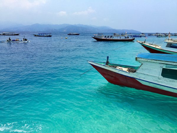 Slow boats in the Southeast Asia ocean - How to Spend Less Than $50 A Day in Bali