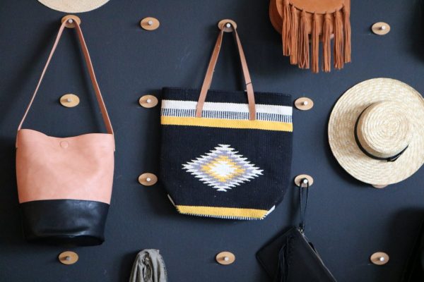 Shop wall purse and hat Create & Cultivate Los Angeles