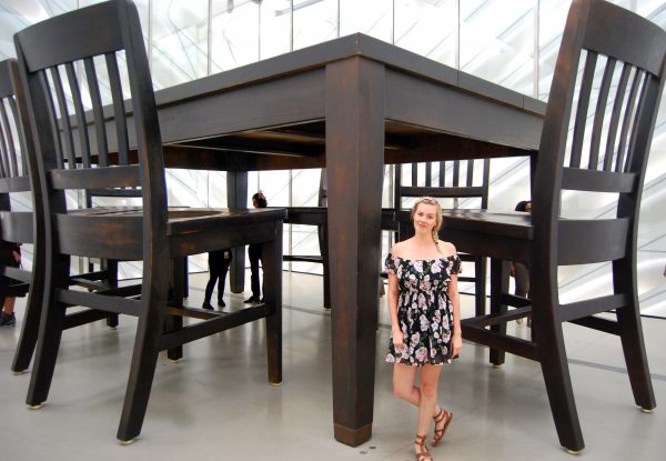 Everything You Need to Know When Visiting The Broad; girl in front of large table and chairs at the broad