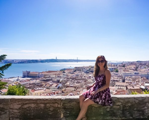 Meet Clumsy Traveler Christine; brunette in black dress over Europe