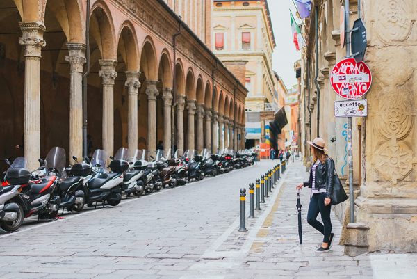 Meet Clumsy Traveler Rachel; girl looking down the street of Bologna