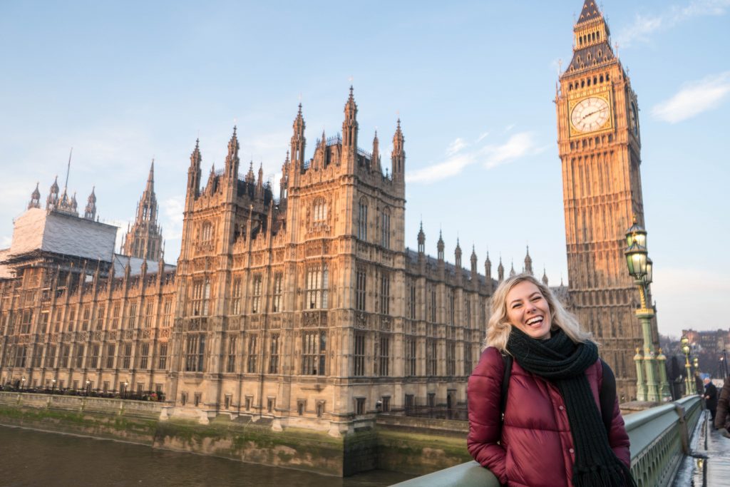 I'm Still The Clumsiest Traveler Ever; blonde girl laughing in front of Big Ben and Parliament London England