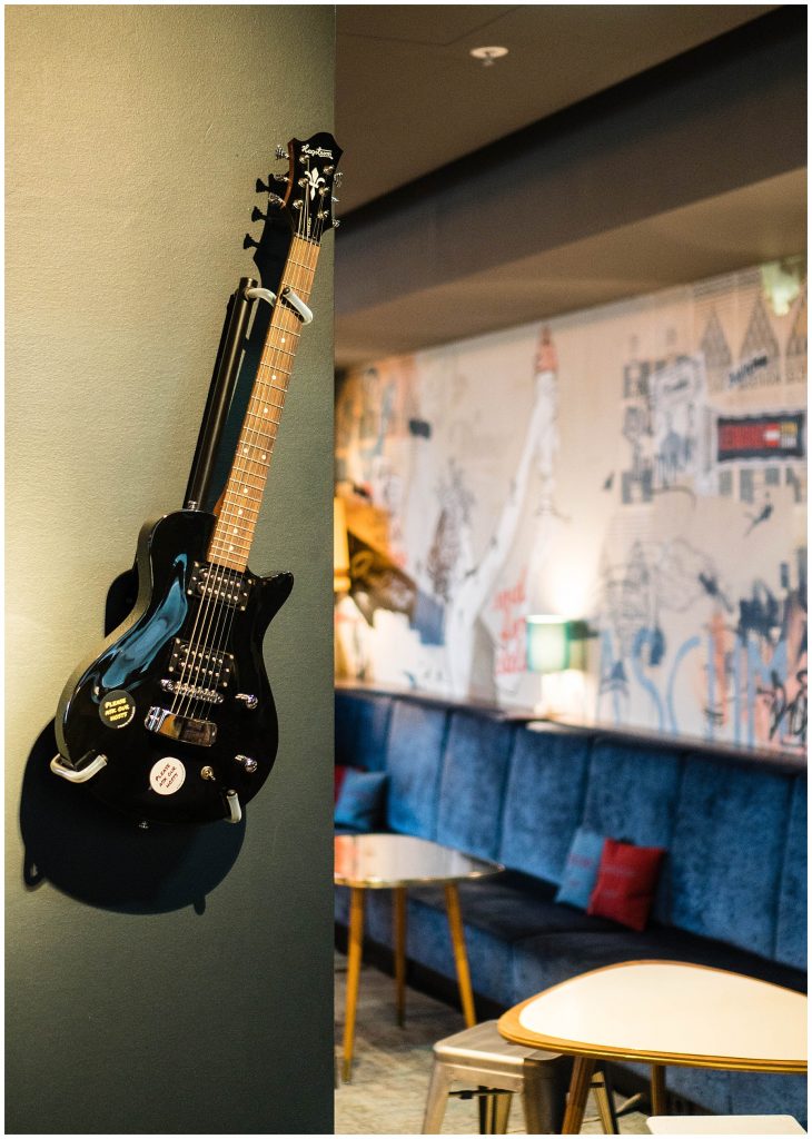 Staying at Ruby Marie; guitar on the wall interior lobby