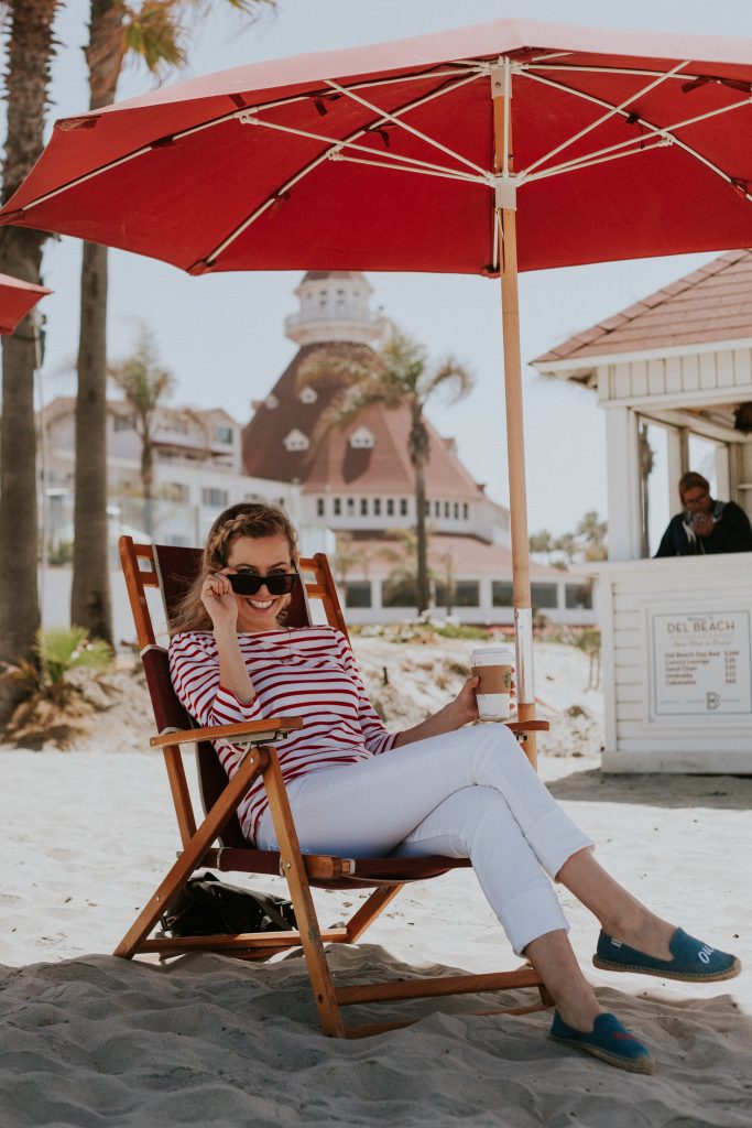 Perfect Stay at Hotel Del Coronado; girl sitting on beach
