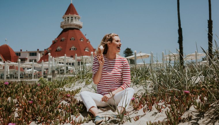 Perfect Stay at Hotel Del Coronado; girl sitting on beach with ice cream