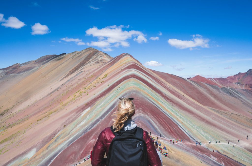 visit Rainbow Mountain; girl hiking Peru