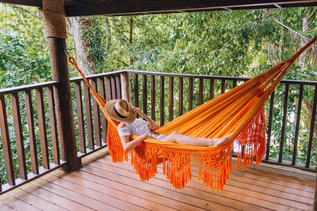 southwest Dominican Republic; girl laying in a hammock; Rancho Platon treehouse