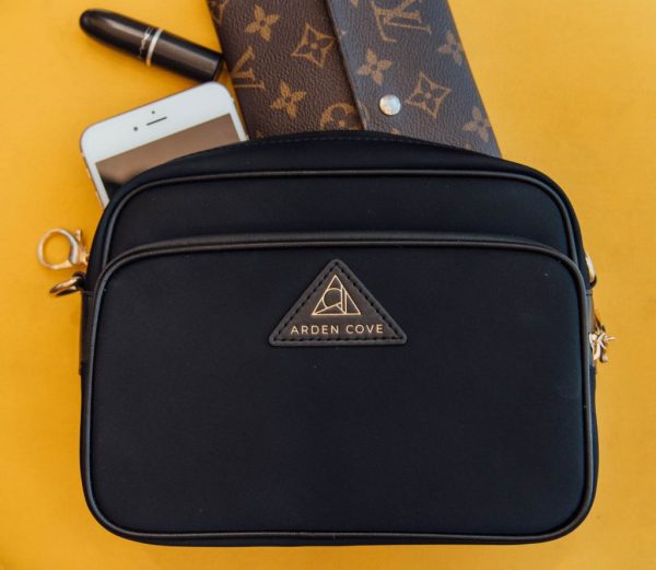 best anti theft purse; The Clumsy Traveler with black Arden Cove cross body bag close up