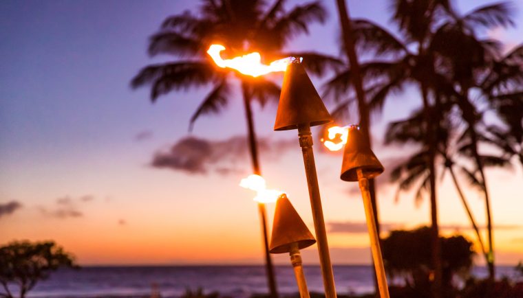 best things to do in Oahu; sunset and tiki torches in Hawaii luau