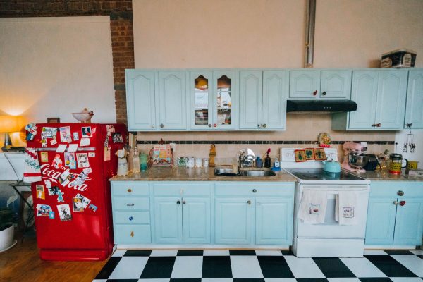 Staying at The Funky Loft in Brooklyn, New York; interior retro apartment details vintage kitchen blue and red retro fridge