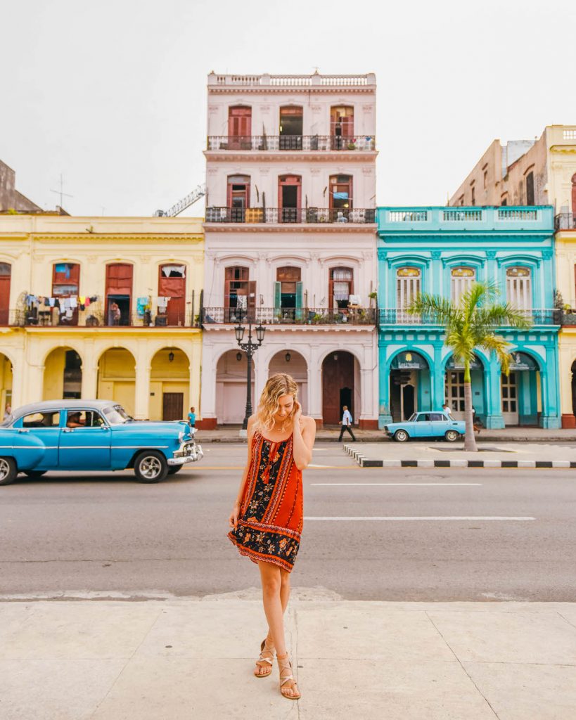 havana cuba photography; street scene of colorful houses in habana with girl