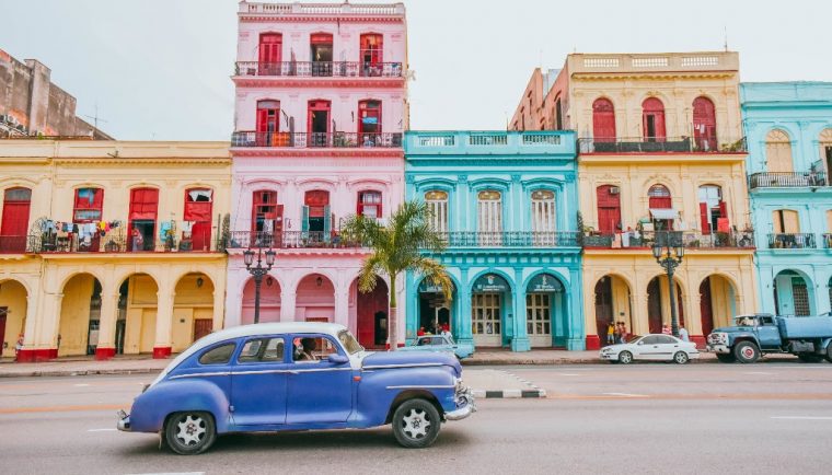 havana cuba photography; street scene of colorful houses in habana with old car